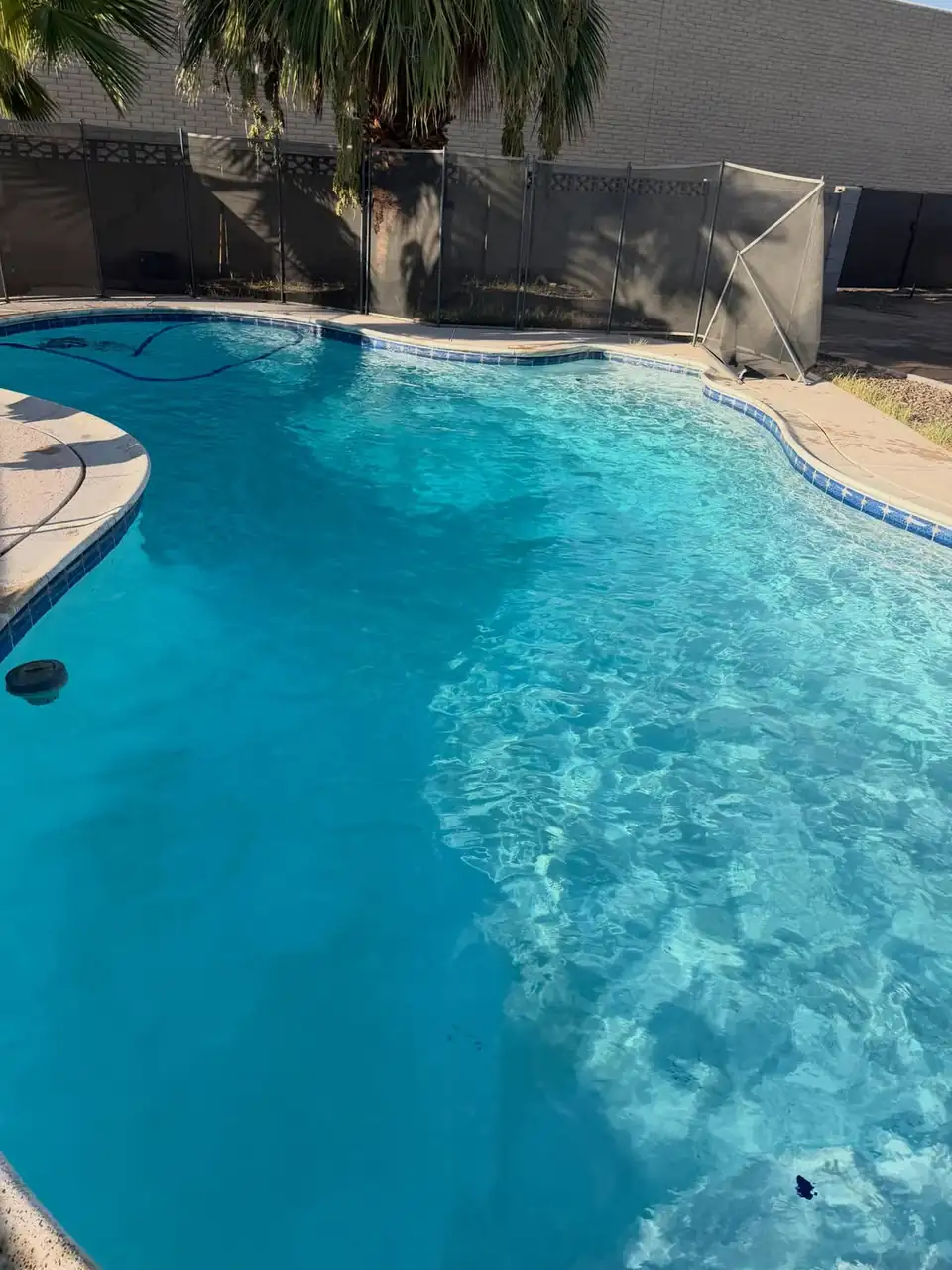 Clear blue pool water along a clean waterline tile band